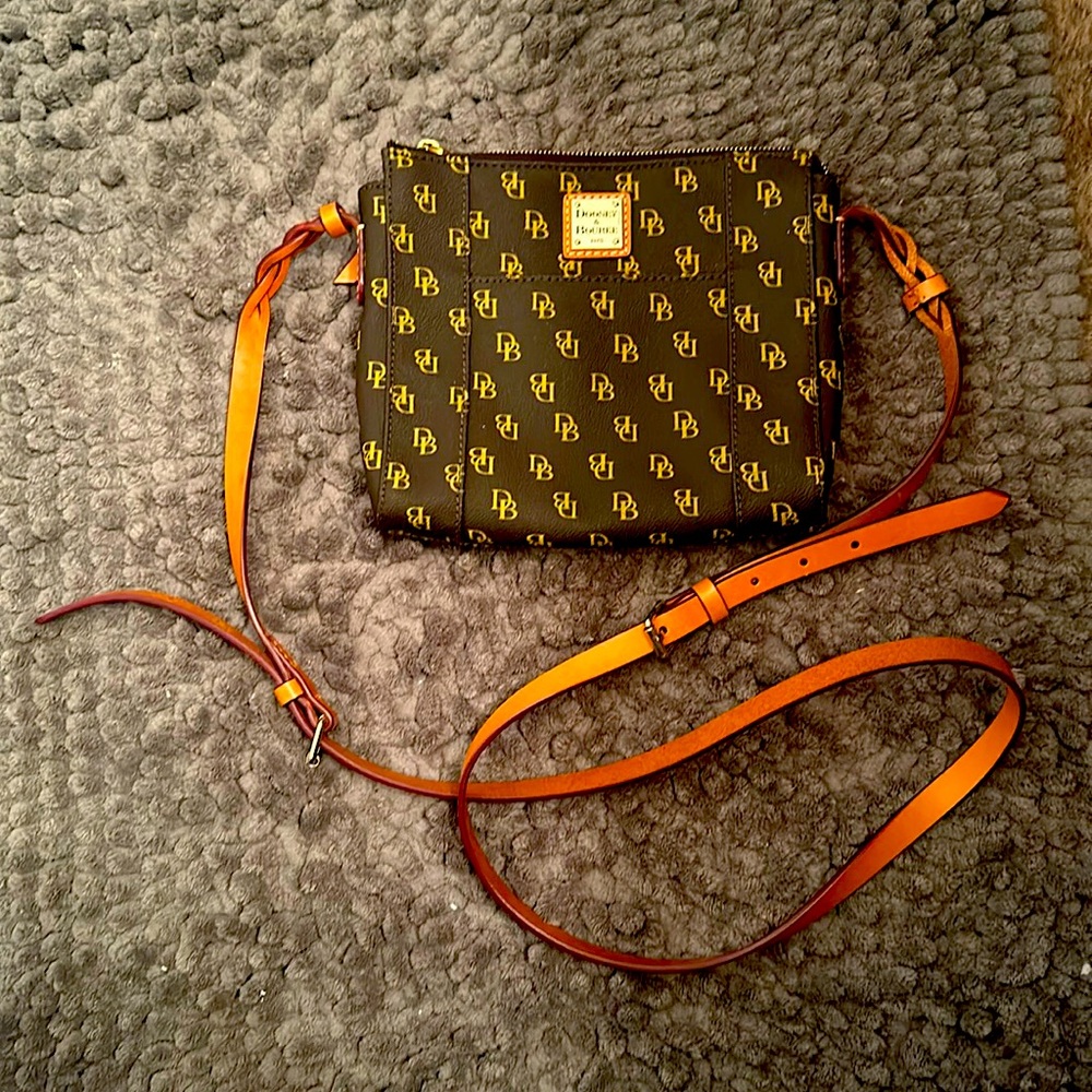 Never worn small cross-body purse. Dark brown body  with light brown strap.